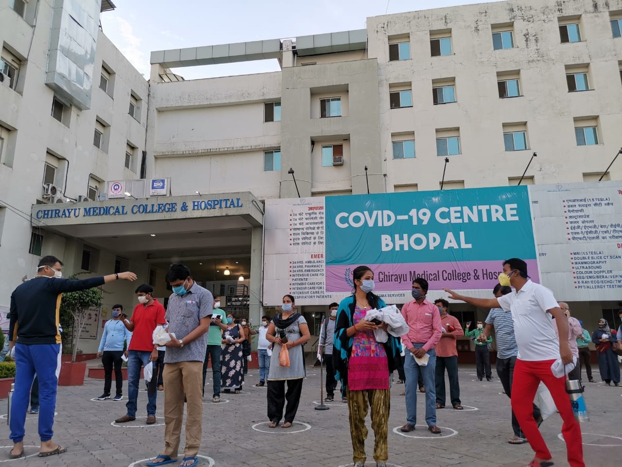 Patients stand outside the hospital, in line with social distancing norms | Angana Chakrabarti | ThePrint