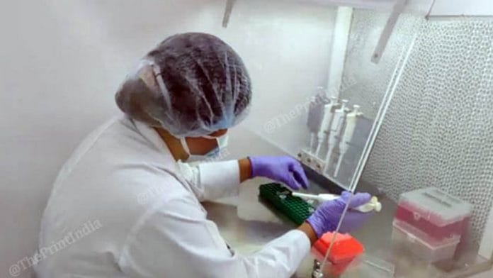 A scientist performing an RT-PCR test | Photo: Angana Chakrabarti | ThePrint