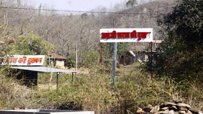 The Aravallis provide a grand backdrop to signage for local bars at Ratanpur village in Rajasthan | Praveen Jain | ThePrint