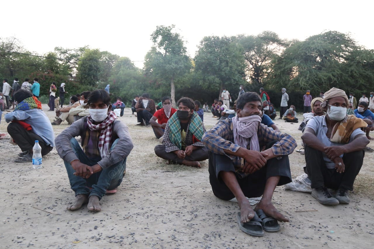 Those who were staying on the Yamuna banks were made to sit in rows. | Photo: Manisha Mondal/ThePrint 