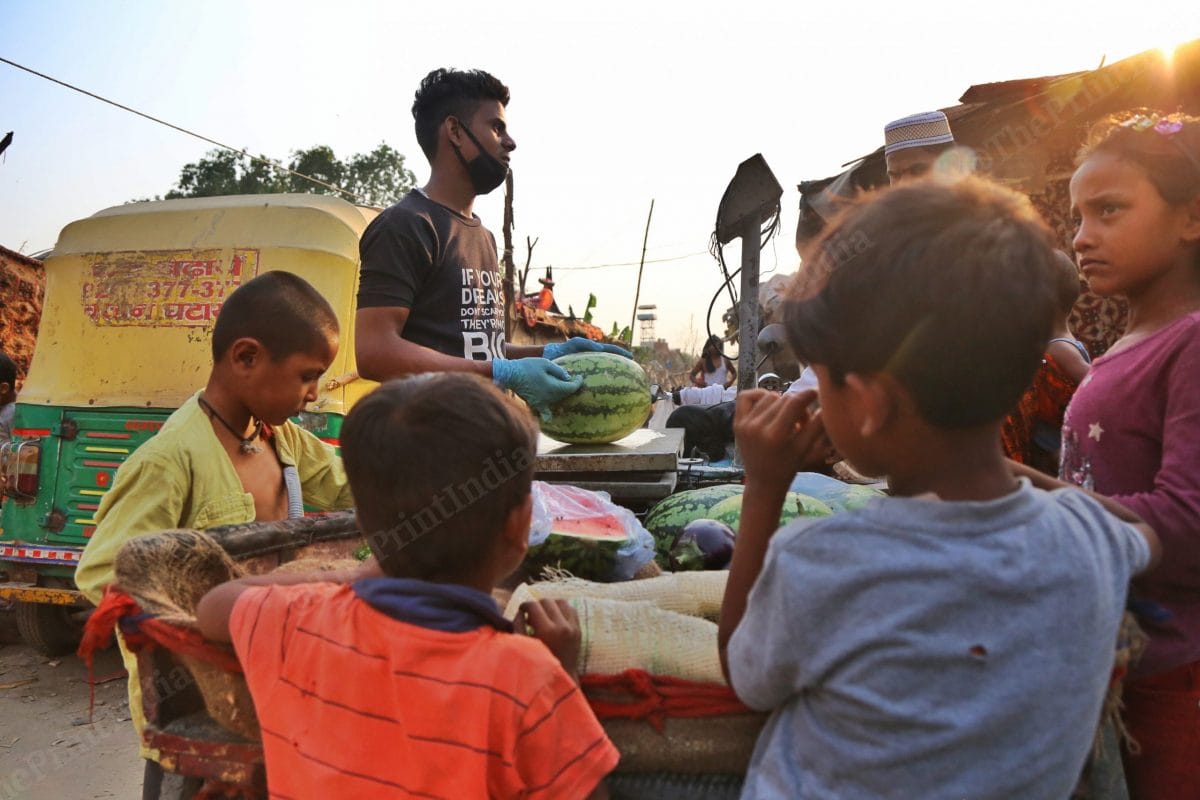There was an excitement in the camp, when the cart came with watermelons | Photo: Manisha Mondal | ThePrint