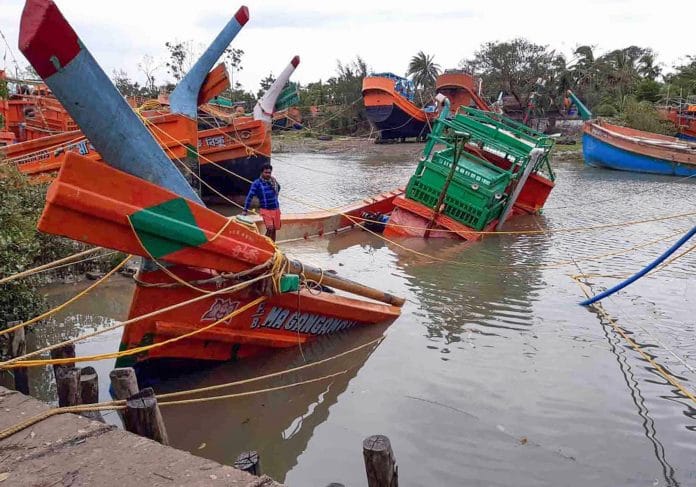 South 24 Paraganas: Damaged boats are seen partially submerged, in the aftermath of Cyclone Amphan, near Sunderbans area in South 24 Paraganas district of West Bengal, Friday, May 22, 2020. (PTI Photo)