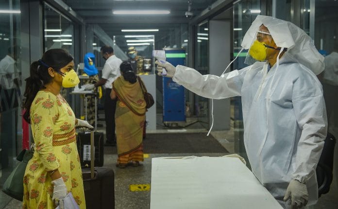 Medics screen passengers as they arrive at the NSCBI Airport to catch a flight for Guwahati, amid ongoing Covid-19 lockdown, in Kolkata, Thursday, May 28, 2020. | PTI