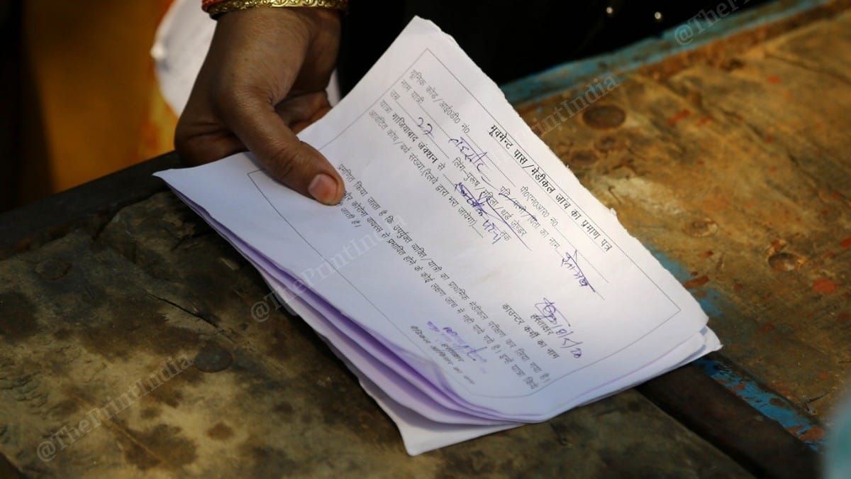 The passes being issued to the migrant workers by the authorities | Photo: Suraj Singh Bisht | ThePrint