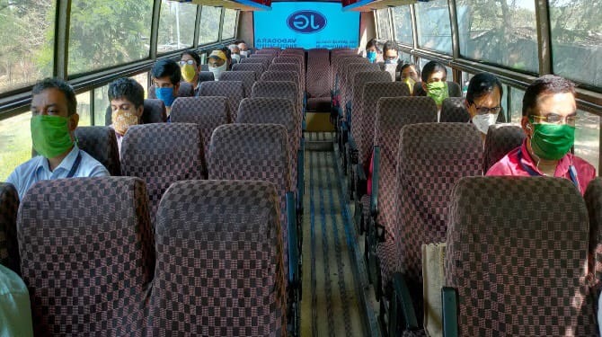 A bus ferrying employees of Alembic Pharmaceuticals | By special arrangement