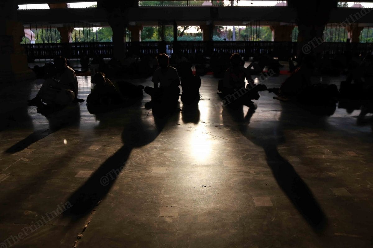 After a long day of struggle migrant workers rest | Photo: Manisha Mondal | ThePrint