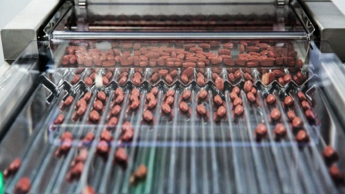 File photo of pills moving through a sorting machine at a pharmaceutical plant in Andhra Pradesh | Sara Hylton | Bloomberg