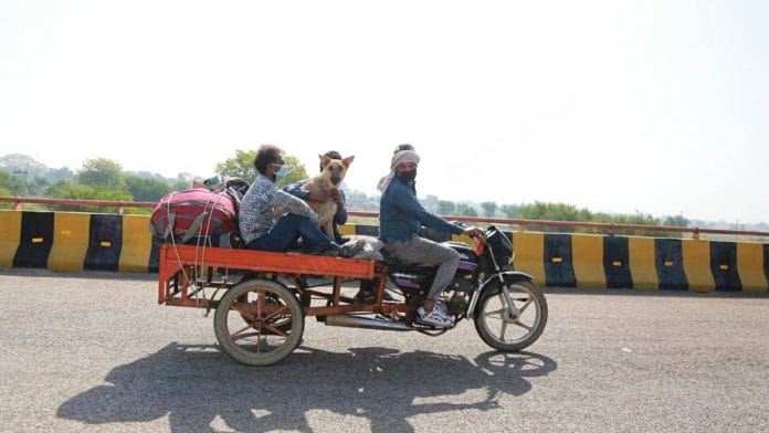 Santosh Kumar and his family, along with Mr Tommy, on their way home to Bundelkhand | Manisha Mondal | ThePrint