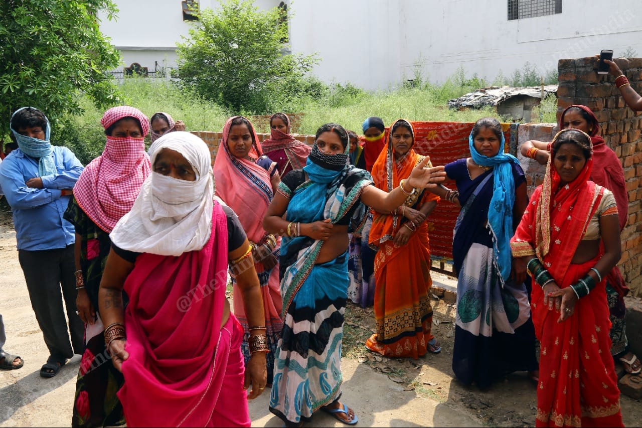 Women at Viraj Khand in Lucknow wait for free food on 28 April | Photo: Suraj Singh Bisht | ThePrint