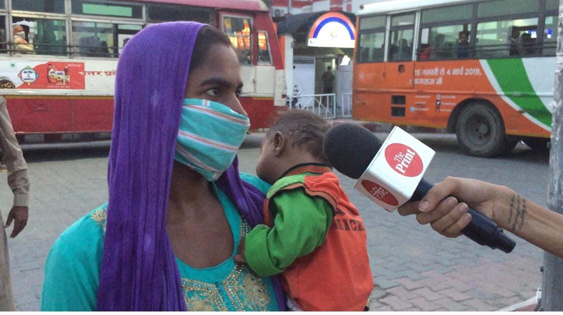 A migrant worker carrying her six-month old child at the Bareilly railway station. | Photo: ThePrint