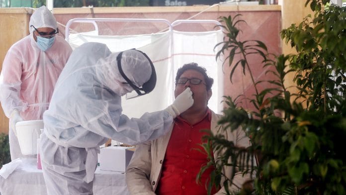 Representational image of a doctor conducting a Covid-19 test in New Delhi | Photo: ANI