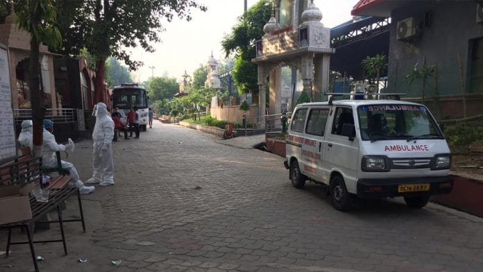 Hospital workers outside the Nigam Bodh Ghat in Delhi | Photo: Sravasti Dasgupta | ThePrint