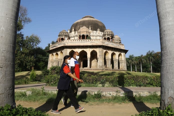 Delhi residents out for a walk in Lodhi Garden wearing masks to protect against Covid-19 | Photo: Suraj Singh Bisht | ThePrint
