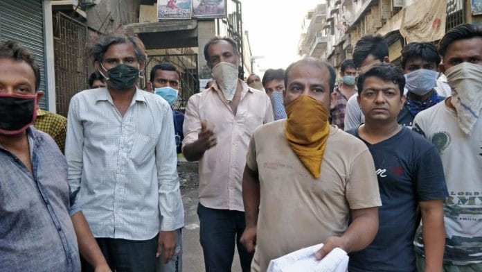 Diamond workers in Surat showing lists of names and phone numbers they submitted to the police station in order to return home by Shramik trains. | Photo: Soniya Agarwal/ThePrint