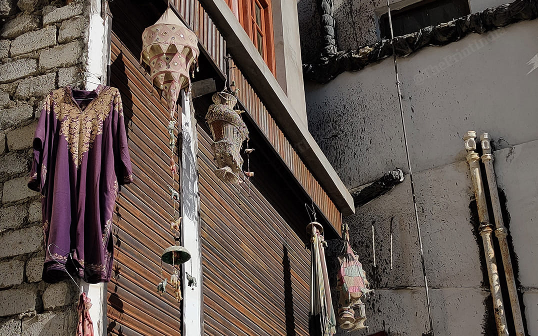 Torn phern and broken schadilliras are seen hanging in some shops as many shopkeepers continue to shut their businesses | Photo: Sajid Ali | ThePrint