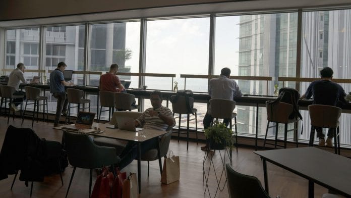 Members work at Aurum Group's Found8 Pte. co-working office space in Singapore | Photographer: Wei Leng Tay | Bloomberg