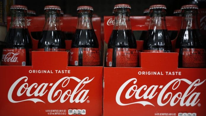 Bottles of Coca-Cola Co. soft drinks are displayed for sale at a store in Louisville, Kentucky, US | Photographer: Luke Sharrett/Bloomberg