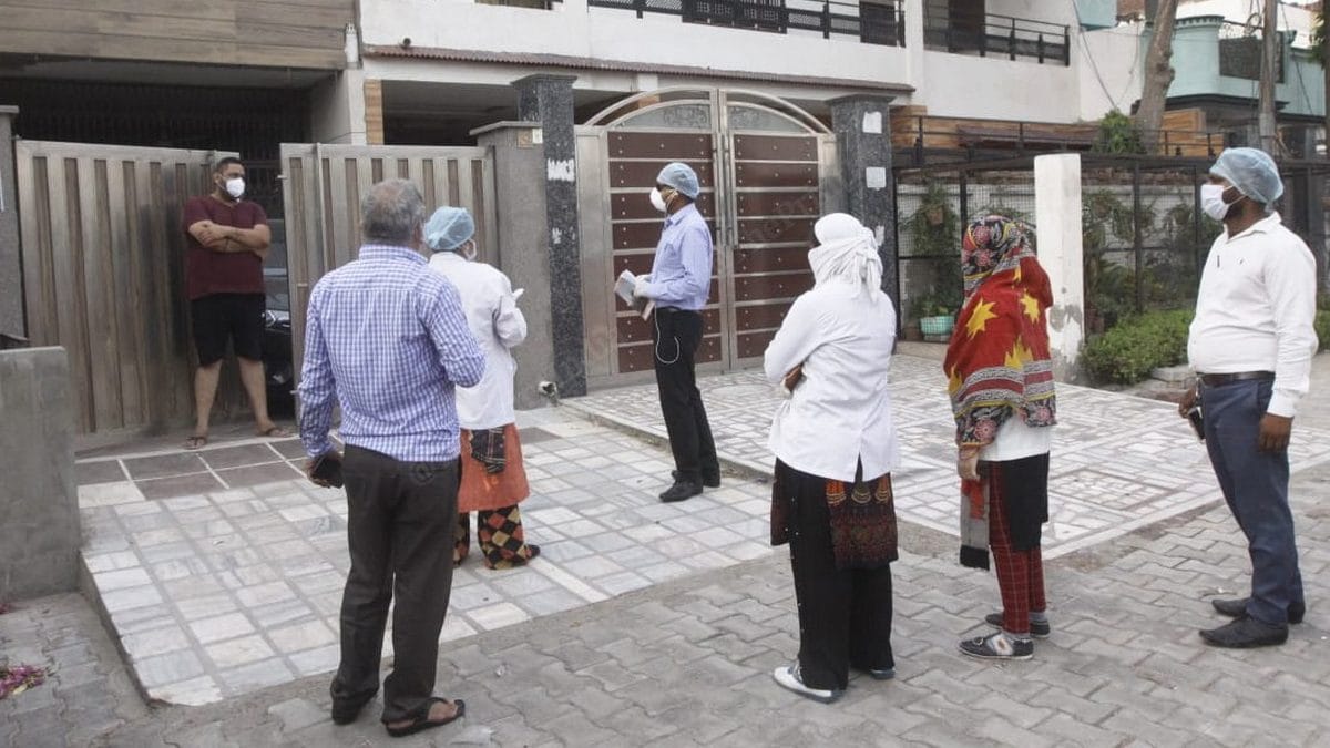 Agra District Magistrate Prabhu N. Singh and his team visit residents | Photo: Praveen Jain | ThePrint