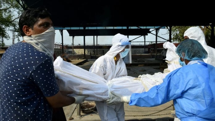 People carry the body of Covid-19 person to the crematorium, on 15 June 2020 | Arun Sharma | PTI