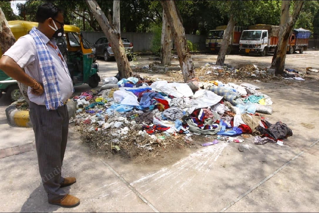 Clothes of the deceased and PPE kits worn by hospital workers transporting the bodies ready to be burnt at Nigambodh Ghat. | Praveen Jain | ThePrint