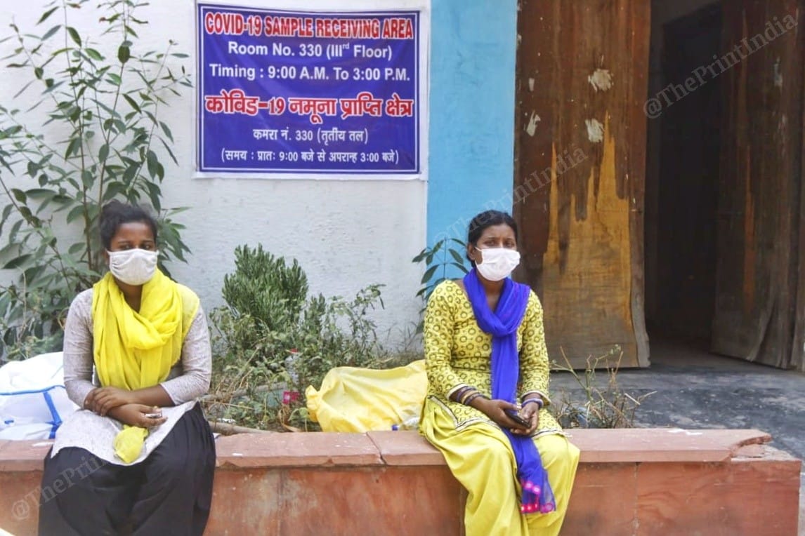 Soniya with her sister outside the LNJP Hospital's mortuary | Praveen Jain | ThePrint