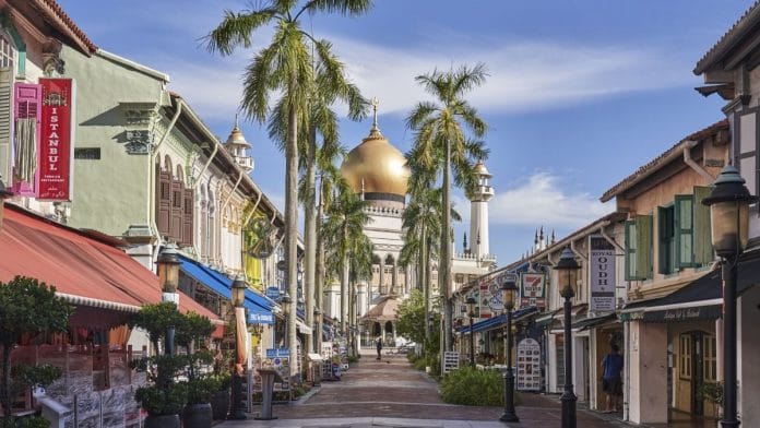 A street stands deserted in the Kampong Glam area during a phased lockdown due to the coronavirus in Singapore, on Tuesday, June 2, 2020. Mostly empty offices, staggered work hours, face shields and contact tracing -- that's what Singapore's cautious return to work will look like under the watchful gaze of the hub's financial regulator. The authority's approach is part of a phased reopening of the city-state, which has been under one of the longest lockdowns in Asia as authorities battled a second wave of coronavirus infections | Bloomberg file photo