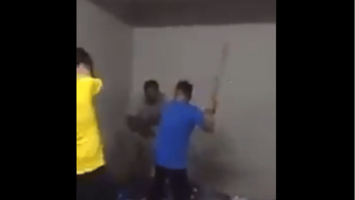 A still from the viral video claiming a Chinese man was caning a Pakistani man | Twitter