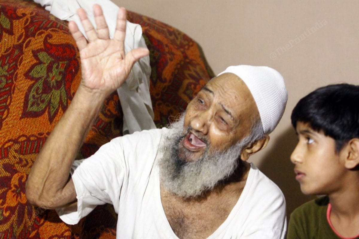 Ahmed's plays with his 11 year old grandson Mohammed Kaif | Photo: Praveen Jain | ThePrint