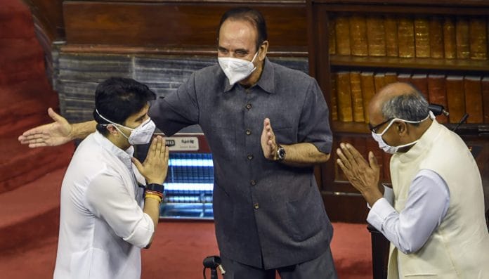 Newly elected Rajya Sabha member Jyotiraditya Scindia (L) greets Ghulam Nabi Azad and Digvijaya Singh before taking oath, at Parliament House Wednesday, July 22, 2020. | Shahbaz Khan/PTI