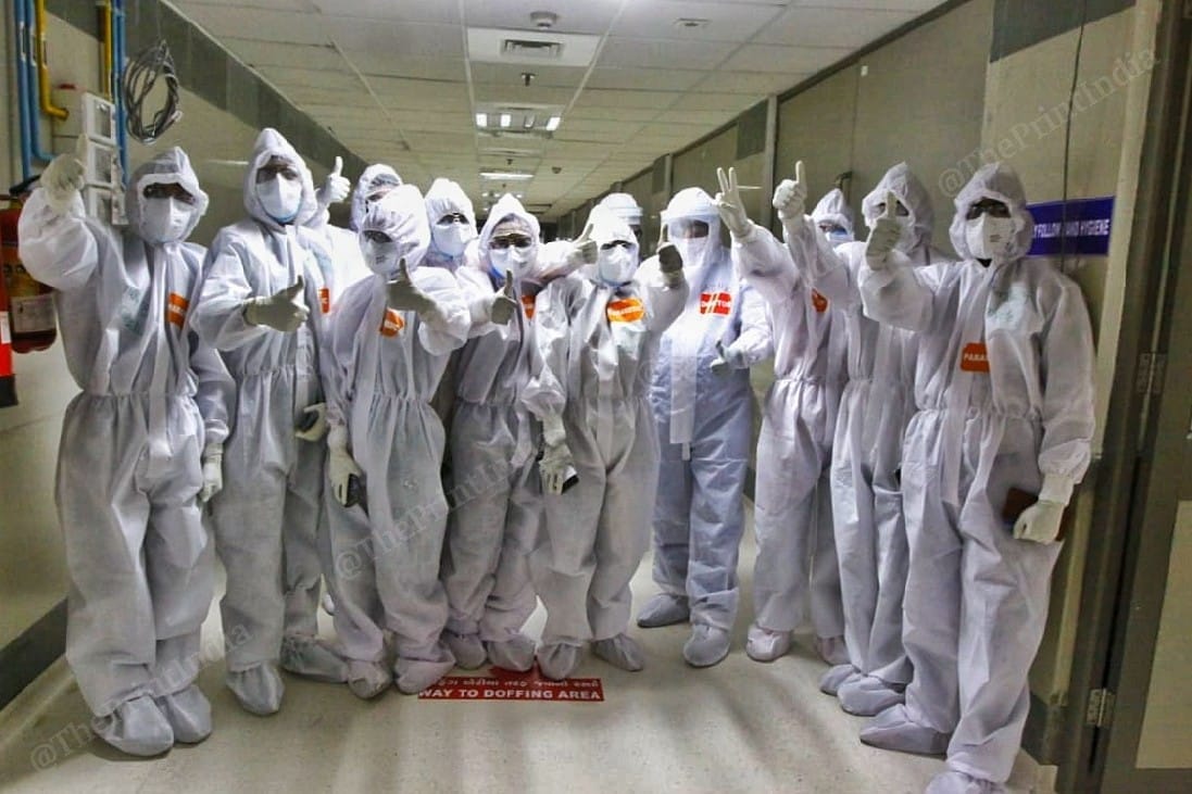 A team of paramedics, nurses and doctors at Civil Hospital, Ahmedabad give a thumbs-up claiming victory over Covid-19. They chanted "Corona haarega, Gujarat jeetega" (Coronavirus will be defeated, Gujarat will win) | Photo: Praveen Jain | ThePrint