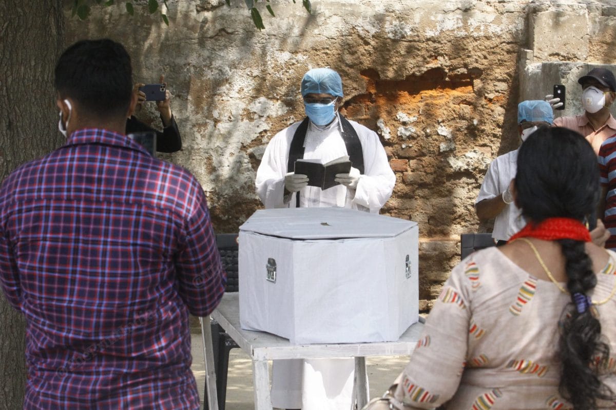 A small ceremony with readings from the Bible took place before the coffin was lowered into the ground | Praveen Jain | ThePrint