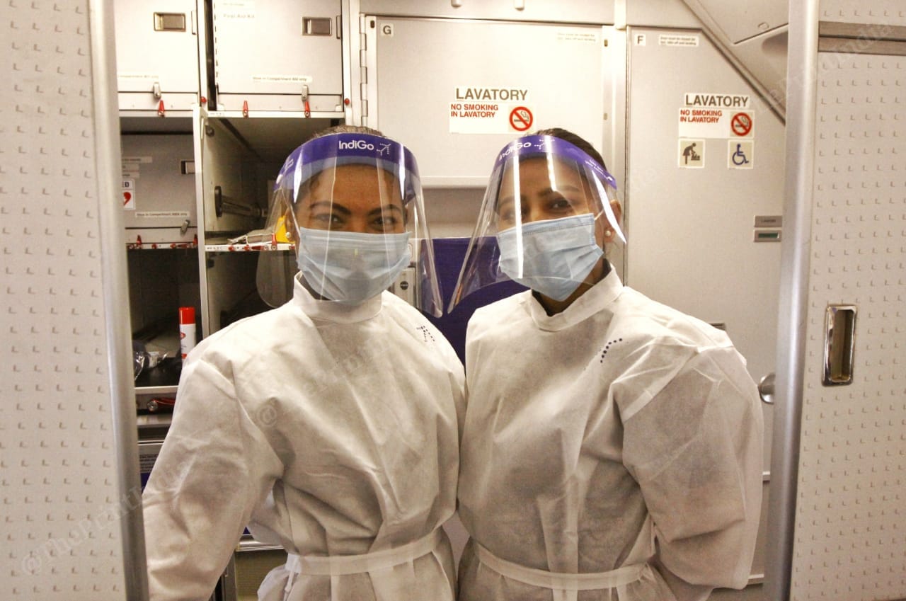 The IndiGo flight attendants smile for photos even though they are in masks and shields | Praveen Jain | ThePrint