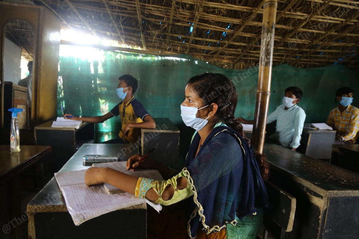 Pal gives masks to the students and has kept sanitiser in the classroom | Photo- Suraj Singh Bisht | ThePrint
