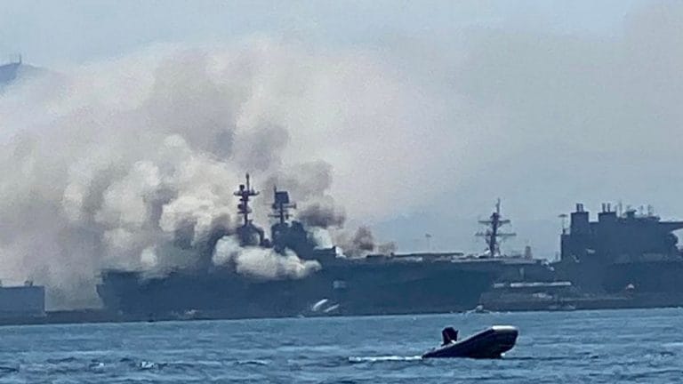 Five days after it caught fire, US Navy warship is still burning at a San Diego base