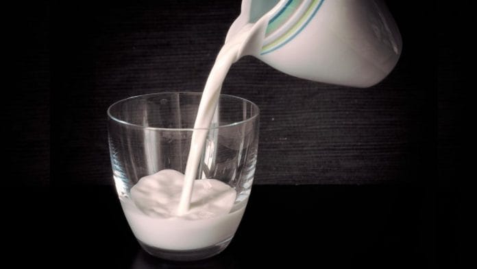 milk being poured into a glass