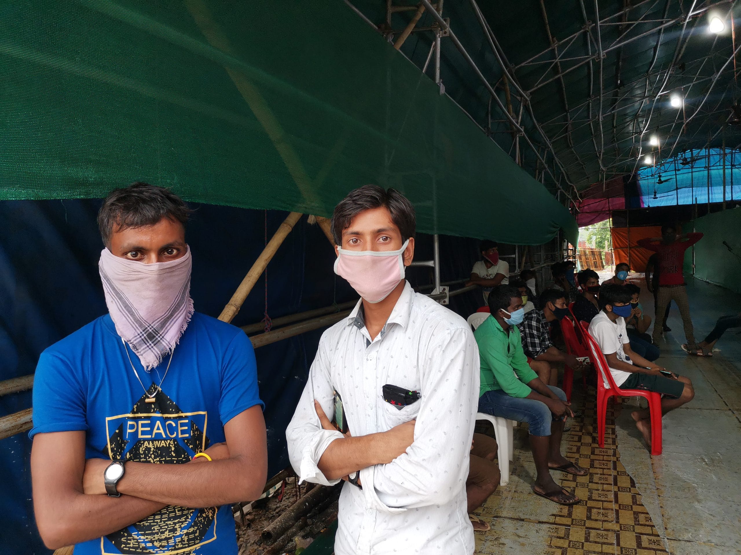 Ismail Sheikh and Azav Ali at the swab collection facility near the Chagolia interstate gate. | Photo: Angana Chakrabarti/ThePrint