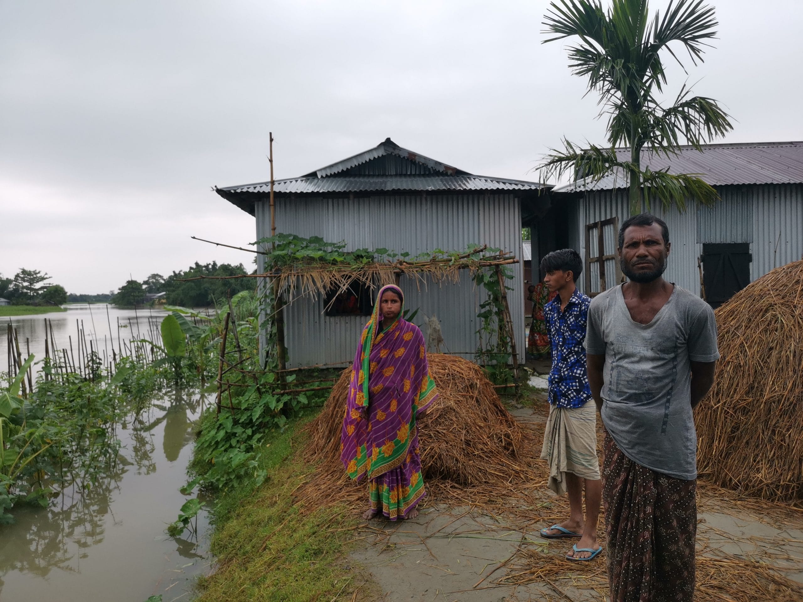 Ismail Sheikh's family outside their house in a char village of Assam's Dhubri district. | Photo: Angana Chakrabarti/ThePrint