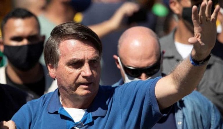Sick with Covid, Brazil’s Bolsonaro defends his virus approach