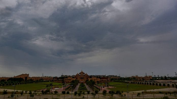 Dark clouds gather in the sky over Akshardham temple, in New Delhi | PTI