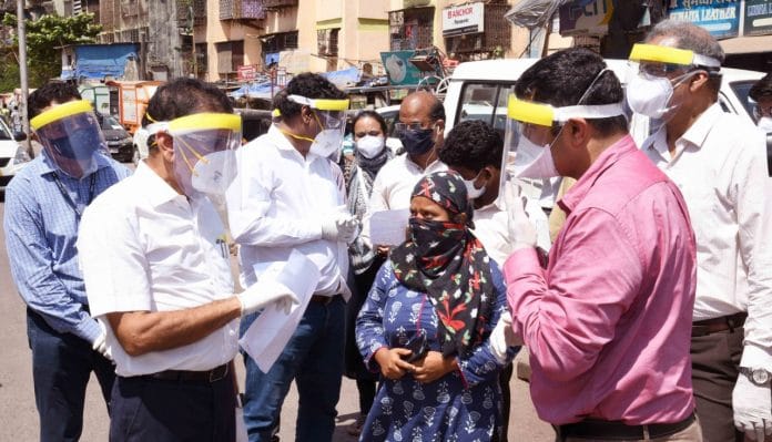 Kiran Dighavkar (in pink shirt) during one of his field visits | By special arrangement