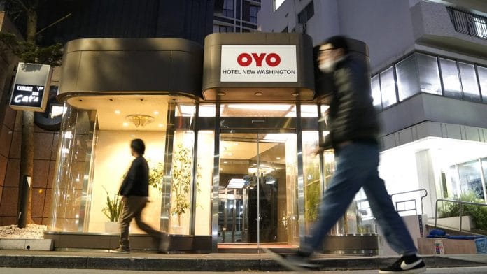 Pedestrians walk past an Oyo hotel, operated by Oyo Hotels Japan G.K., in Tokyo, Japan | Bloomberg