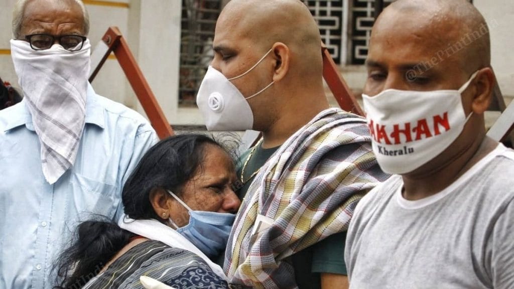 Lataben, who lost her sister Jyotiben in the Shrey Hospital fire, cries with the deceased's sons | Photo: Praveen Jain | ThePrint