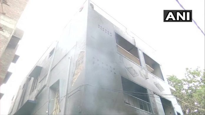 A building torched by the mob in Bengaluru Tuesday night | Photo: @ANI | Twitter