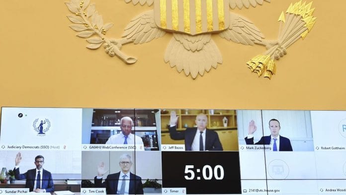 Mark Zuckerberg of Facebook, top right, Jeff Bezos of Amazon, top centre, Sundar Pichai of Alphabet, bottom left, and Tim Cook of Apple, centre left, swearing in during a US House Judiciary Subcommittee hearing, 29 July | Mandel Ngan/AFP/Bloomberg
