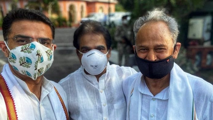 Rajasthan CM Ashok Gehlot (right) and former deputy CM Sachin Pilot (left) with Congress general secretary K.C. Venugopal at a legislature party meeting in Jaipur Thursday | Photo: ANI