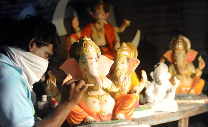 An idol maker hard at work in Mumbai ahead of Ganesh Chaturthi, which starts 22 August | ANI