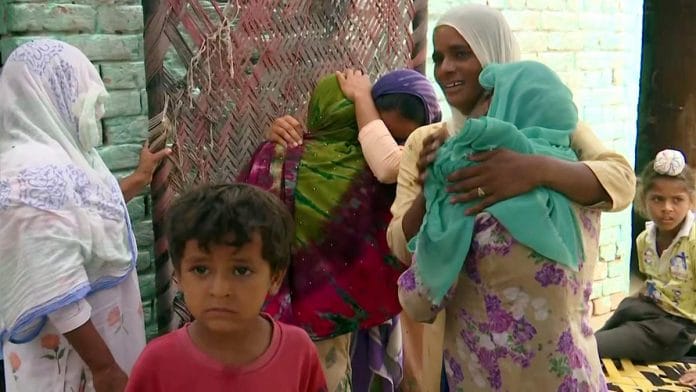 Families of victims of the Punjab hooch tragedy mourn in Tarn Taran district | Photo: ANI