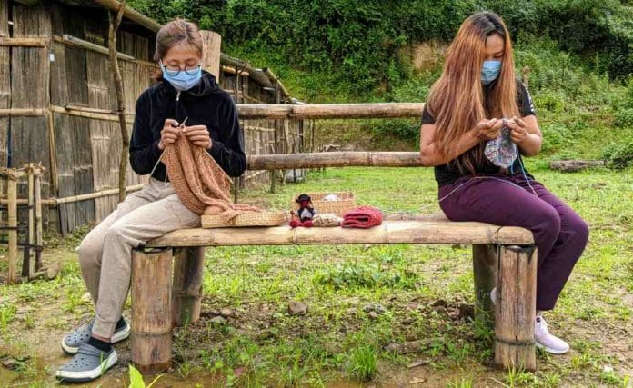 Tshewulou Thopi (R), who works with a cruise line in South Africa, knits with a returnee from Bengaluru, at Chizame's ‘Covid-19 creativity hub’, | Yimkumla Longkumer | ThePrint