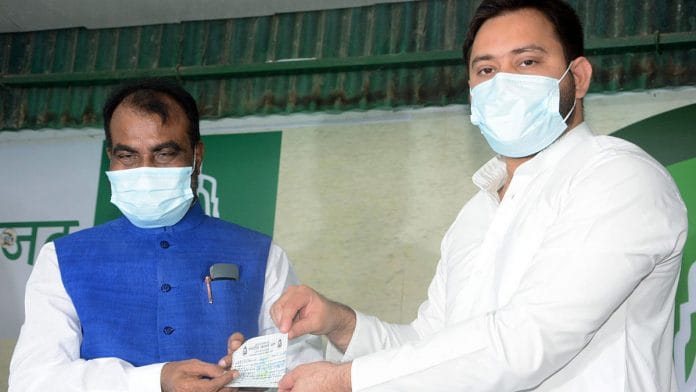 Former minister Shyam Rajak (left) is welcomed into the RJD by Tejashwi Yadav Monday | Photo: ANI