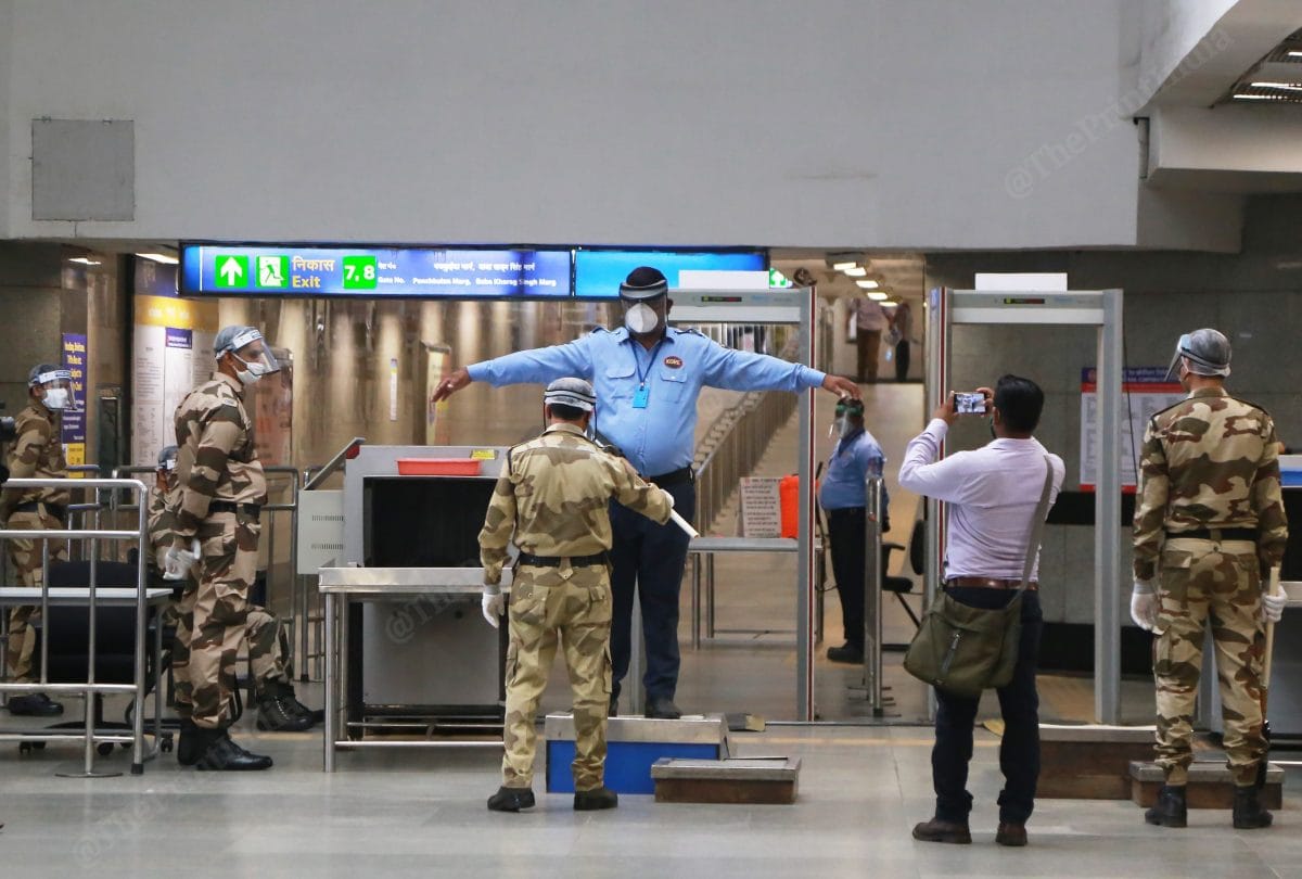 At the frisking point people have to stand maintaining social distance | Photo: Manisha Mondal | ThePrint